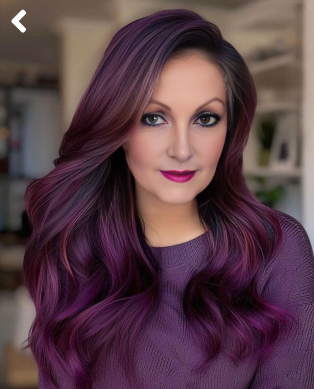 Model Has Fantasy Hair color done with four different shades of Burgundy & purple hair color. long wavy hair. Beauty salon Winter Park, Fl & Casselberry, Fl.